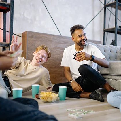 A lively scene of friends playing a board game, showcasing the joy and unity that friendship brings to their lives.