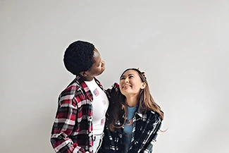 Two young friends, symbolizing acceptance and the journey of becoming better together.