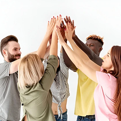 A joyful gathering of people in a circle, hands uplifted, representing the positive impact of friendship on all involved.