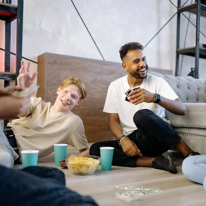 A lively scene of friends playing a board game, showcasing the joy and unity that friendship brings to their lives.
