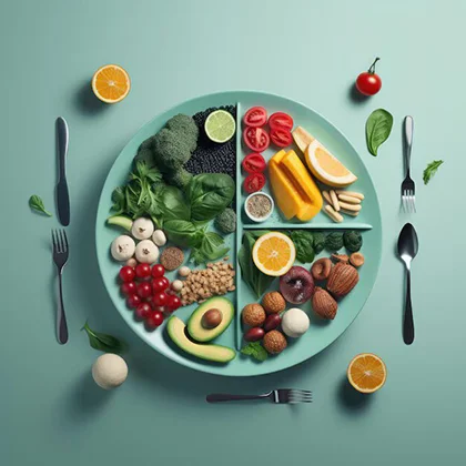 A well-arranged plate of fresh fruits and vegetables, with utensils beside it, emphasizing the importance of healthy nutrition.