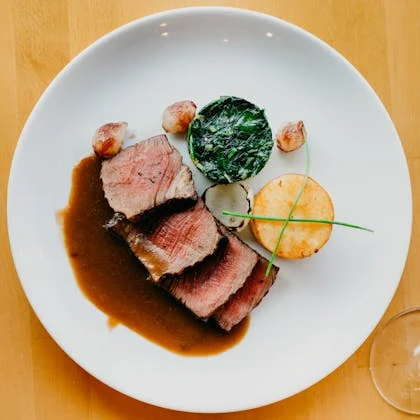 A delicious plate of steak, potatoes, and gravy, emphasizing the importance of portion control for a healthy lifestyle