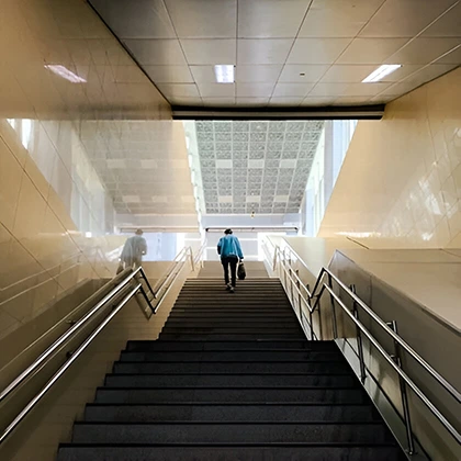 A person walks up the stairs, encouraging a more active approach to daily life and wellness.
