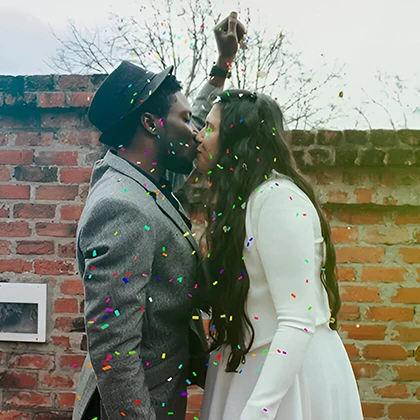 Colorful confetti shower celebrating the joyful union of a couple, capturing their love and happiness on their wedding day.