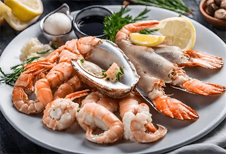 A delicious seafood platter with oysters, shrimp, and assorted seafood, suitable for those following a keto diet.